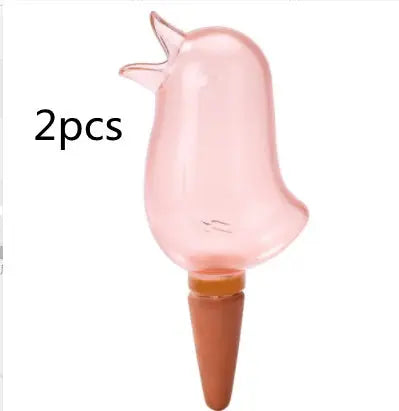 Pink bird-shaped glass plant watering globe with terracotta spike, set of 2