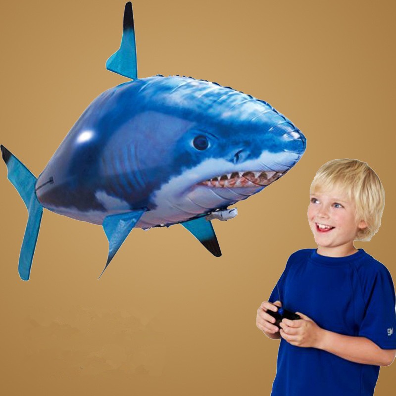 Remote control air swimming shark toy gliding through the air, showcasing its vibrant colors and smooth design.
