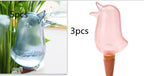 Glass bird-shaped plant watering globes, blue and pink, shown in sets of 5 and 3