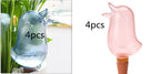 Set of 4 bird-shaped glass plant watering globes in blue and pink for indoor gardening