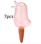 Pink bird-shaped plant watering stake with terra cotta spike, labeled 7pcs.