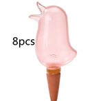 Set of 8 bird-shaped glass plant watering spikes for garden irrigation