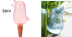 Bird-shaped self-watering stakes for plants, shown in pink and blue, set of 2 pieces
