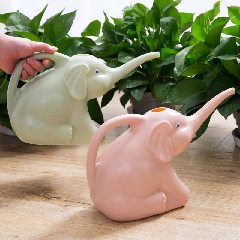 Baby elephant watering flowers - soilcommander