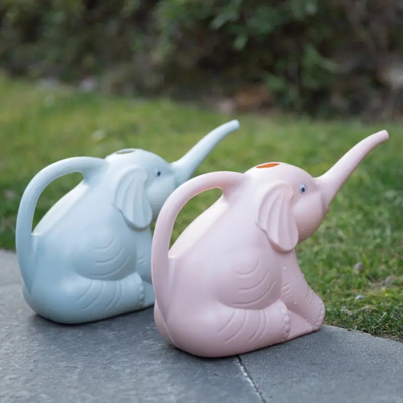 Baby elephant watering flowers - soilcommander