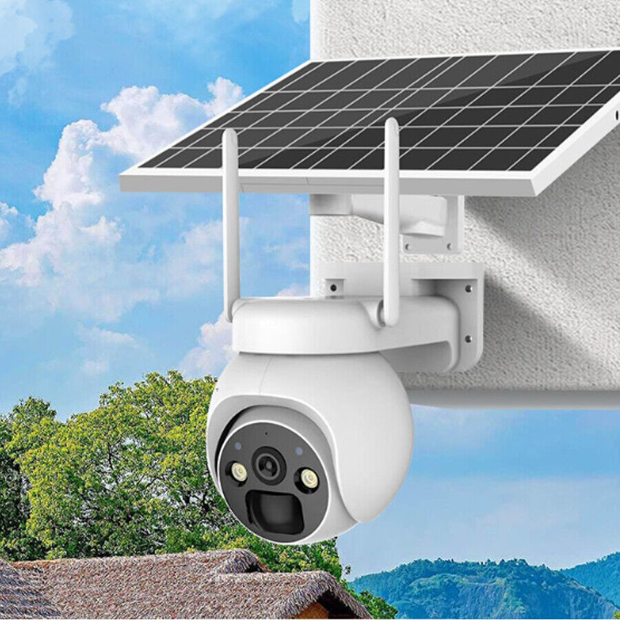 Solar-powered security camera on a wall with a blue sky and trees in the background