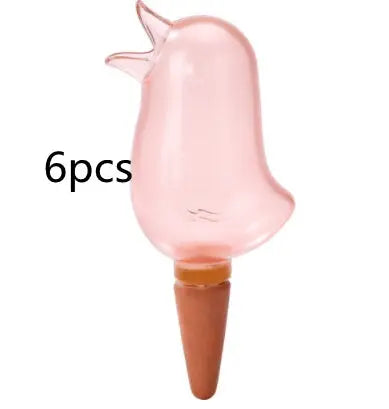 Set of 6 pink bird-shaped glass plant watering spikes for garden irrigation