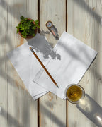 Printed pages from the Global vegetable garden planner PDF laid out with seed packets and a pencil
